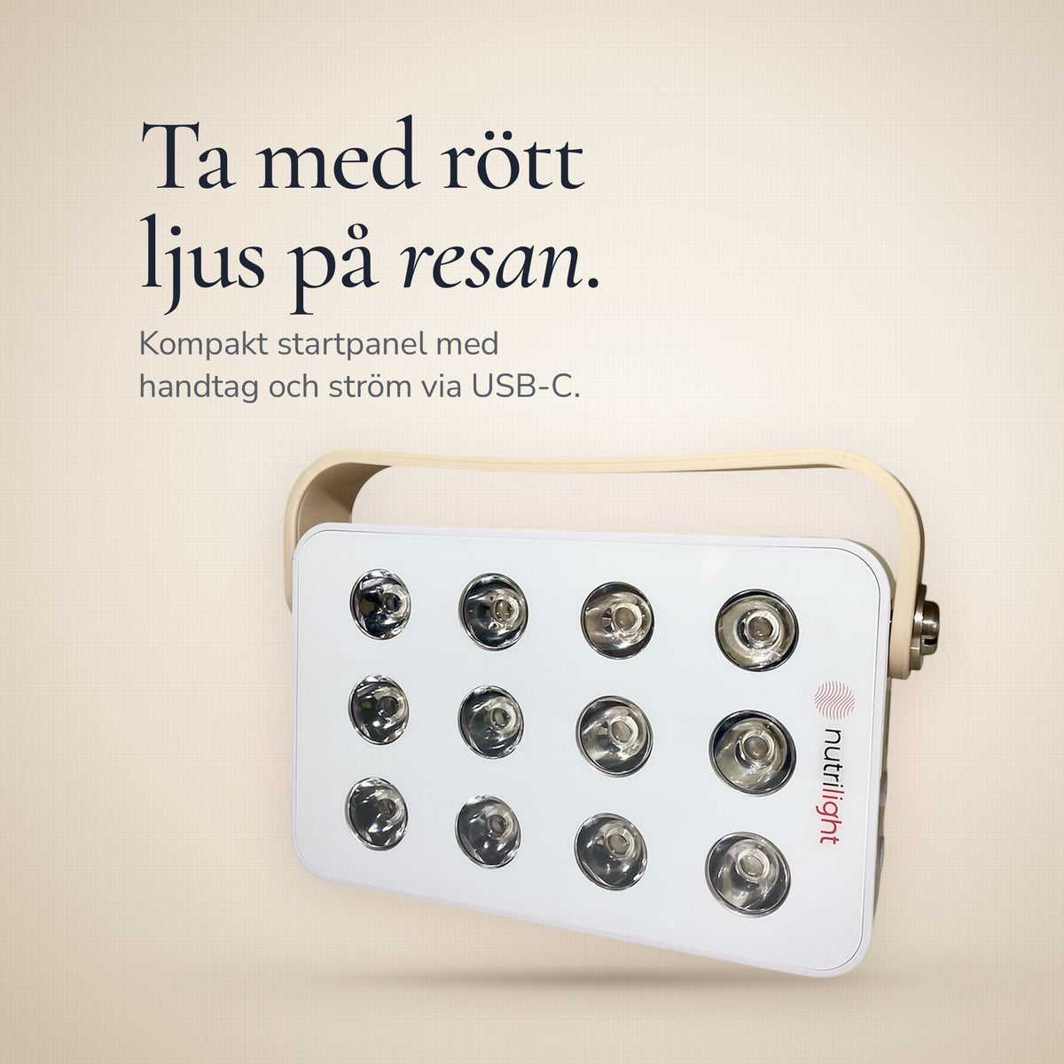 Robin Gen 2, et kompakt rødt lyspanel med håndtag, mod en lys hørfarvet baggrund. Kompakt startpanel med strøm via USB-C.